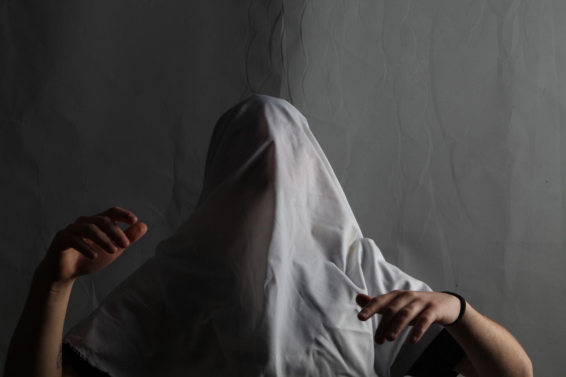 A Person Face Covered with White Cloth