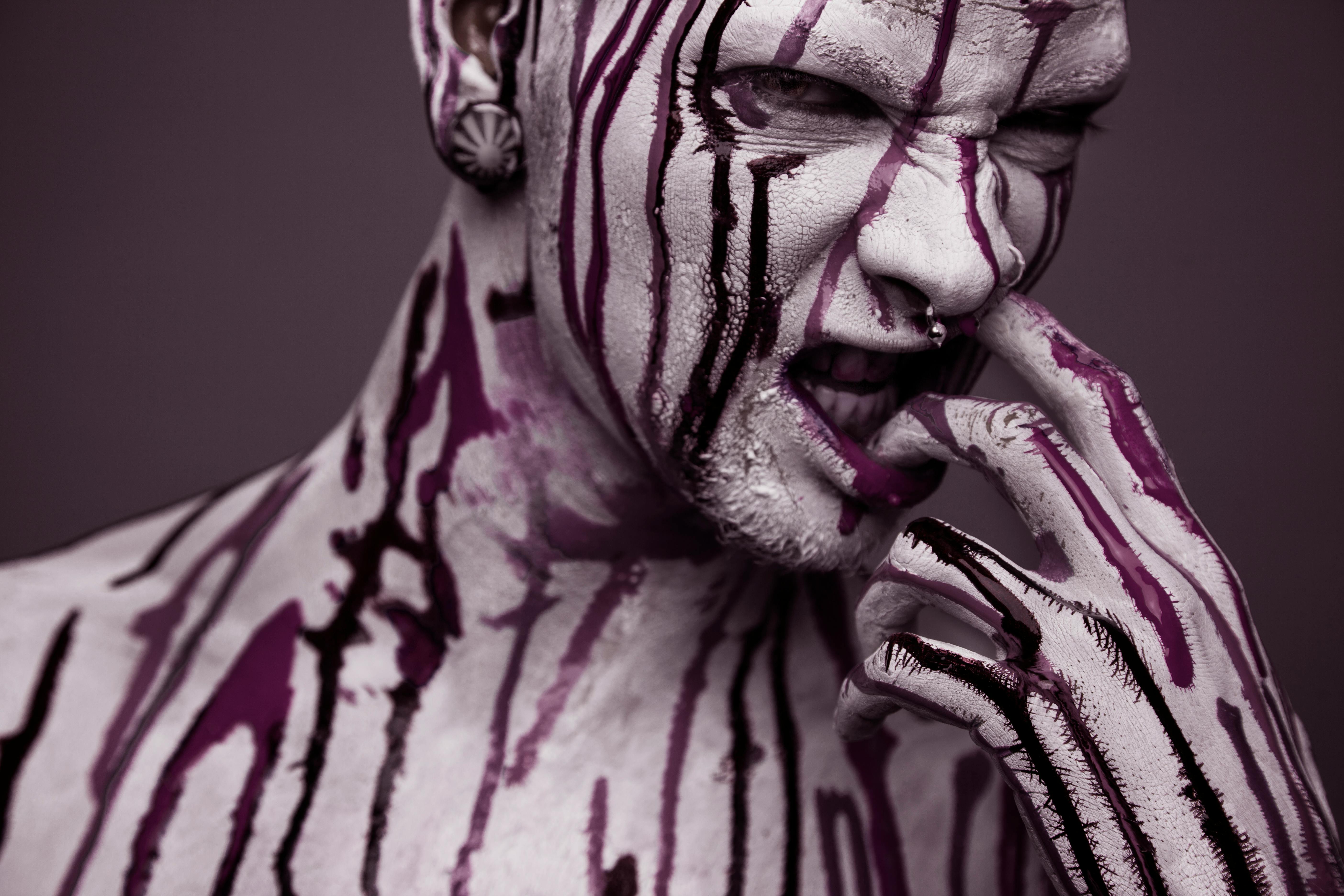 a model covered with paint looking fierce