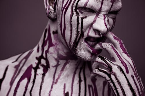 Free A Model Covered with Paint Looking Fierce Stock Photo