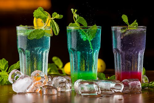 Free Selective Focus of Cocktail Drinks on Wooden Surface Stock Photo