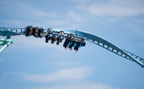 People Riding Roller Coaster