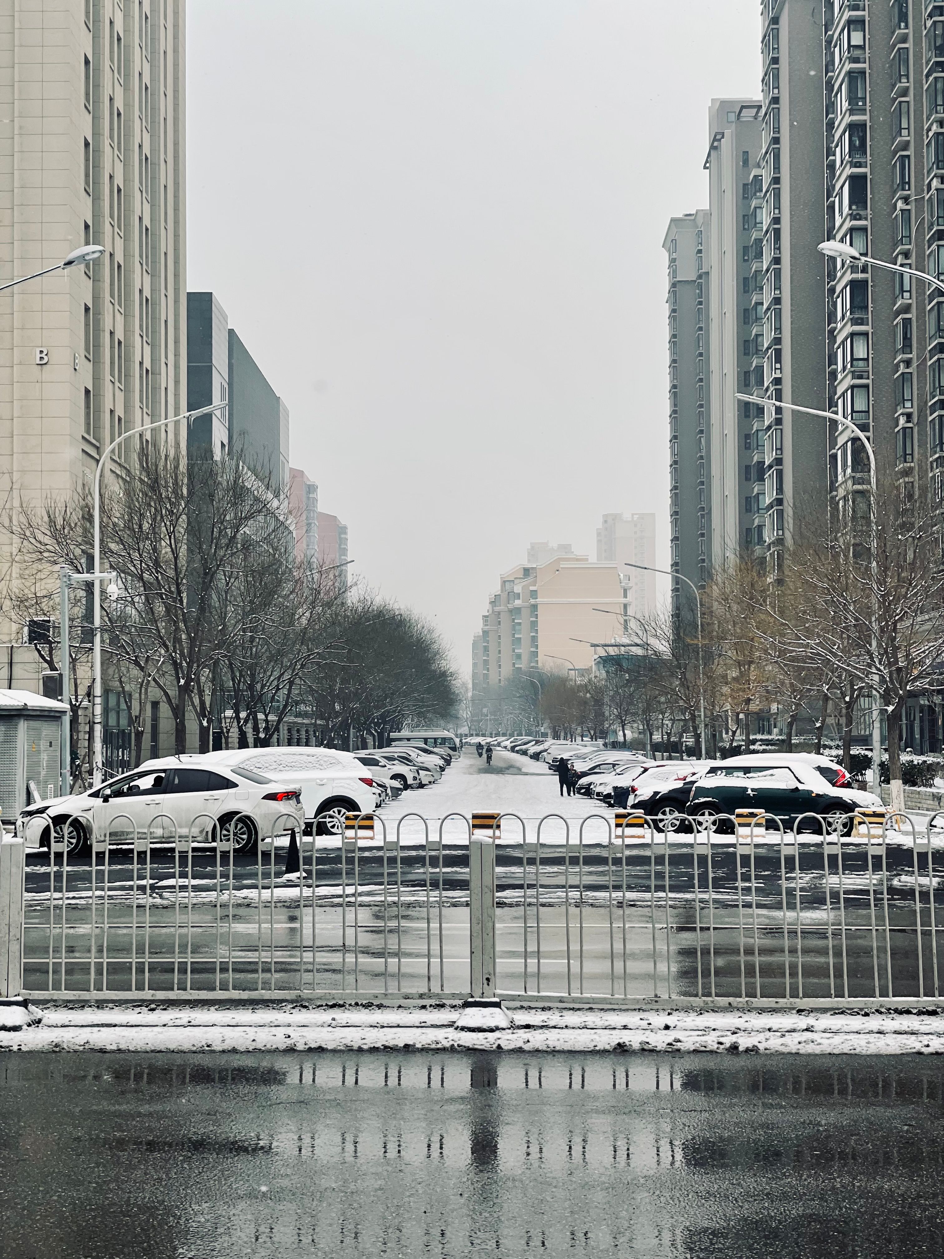 Cars Parked on Parking Lot Near High Rise Buildings · Free Stock Photo