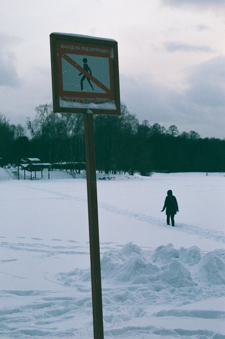 Person Walking In Snow In Restricted Area