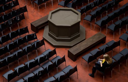 Woman Sitting in Auditorium