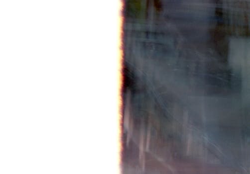 Abstract image capturing light leaks and textures from the end of a film roll.