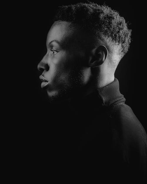 Grayscale Photo of a Man in Turtleneck Shirt