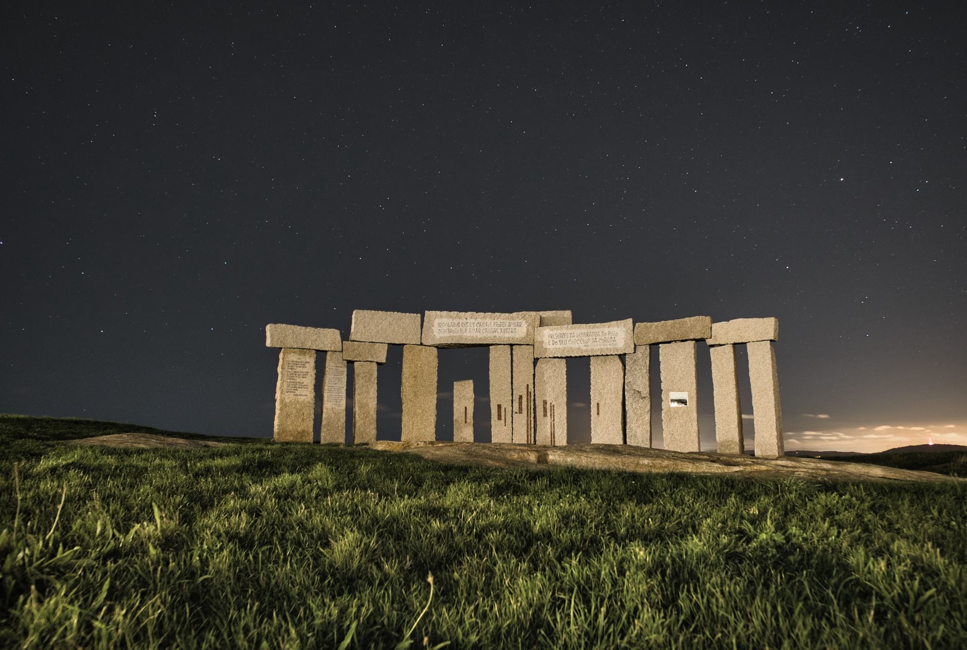 Captivating monument with a starry night sky in A Coruña, Spain.