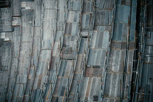 High-angle view of metal scaffolding at a construction site, capturing industrial textures.
