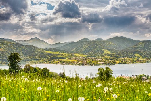 Breathtaking panorama of Tegernsee Lake surrounded by the lush Bavarian Alps in summer.