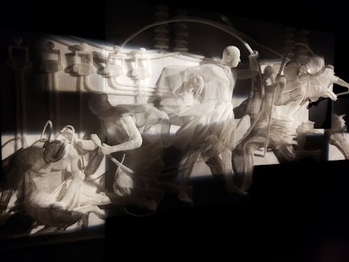Visual Art Presentation Statues in a Dark Room