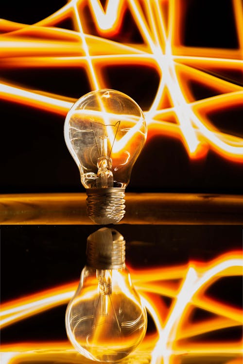 Free Light Bulb with Full Reflection in Close-up Shot Stock Photo