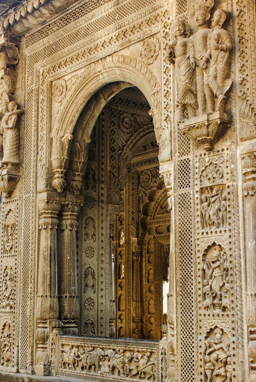 Intricate Stone Carving on a Temple Arch Window 