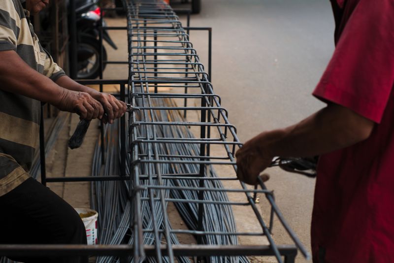 Crew tying steel reinforcement for a foundation pour