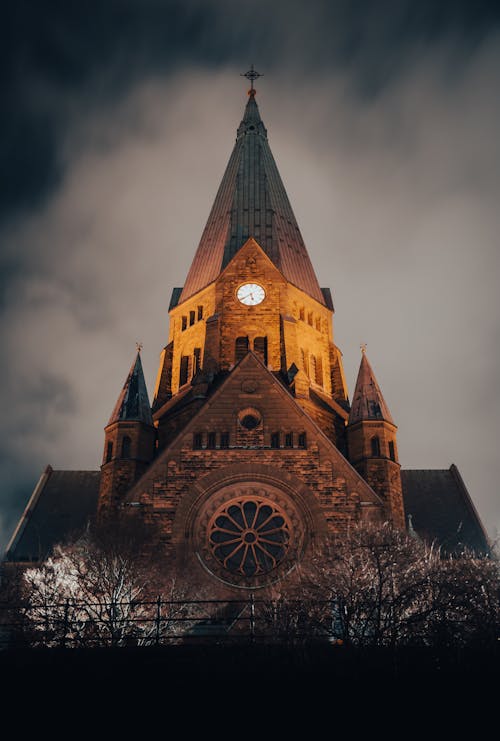 Photo of a Church Under Cloudy Sky