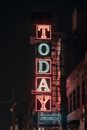 A Lighted Signboard mounted on a Building