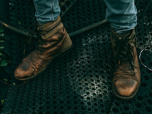 Free A Person Wearing Brown Leather Boots Stock Photo