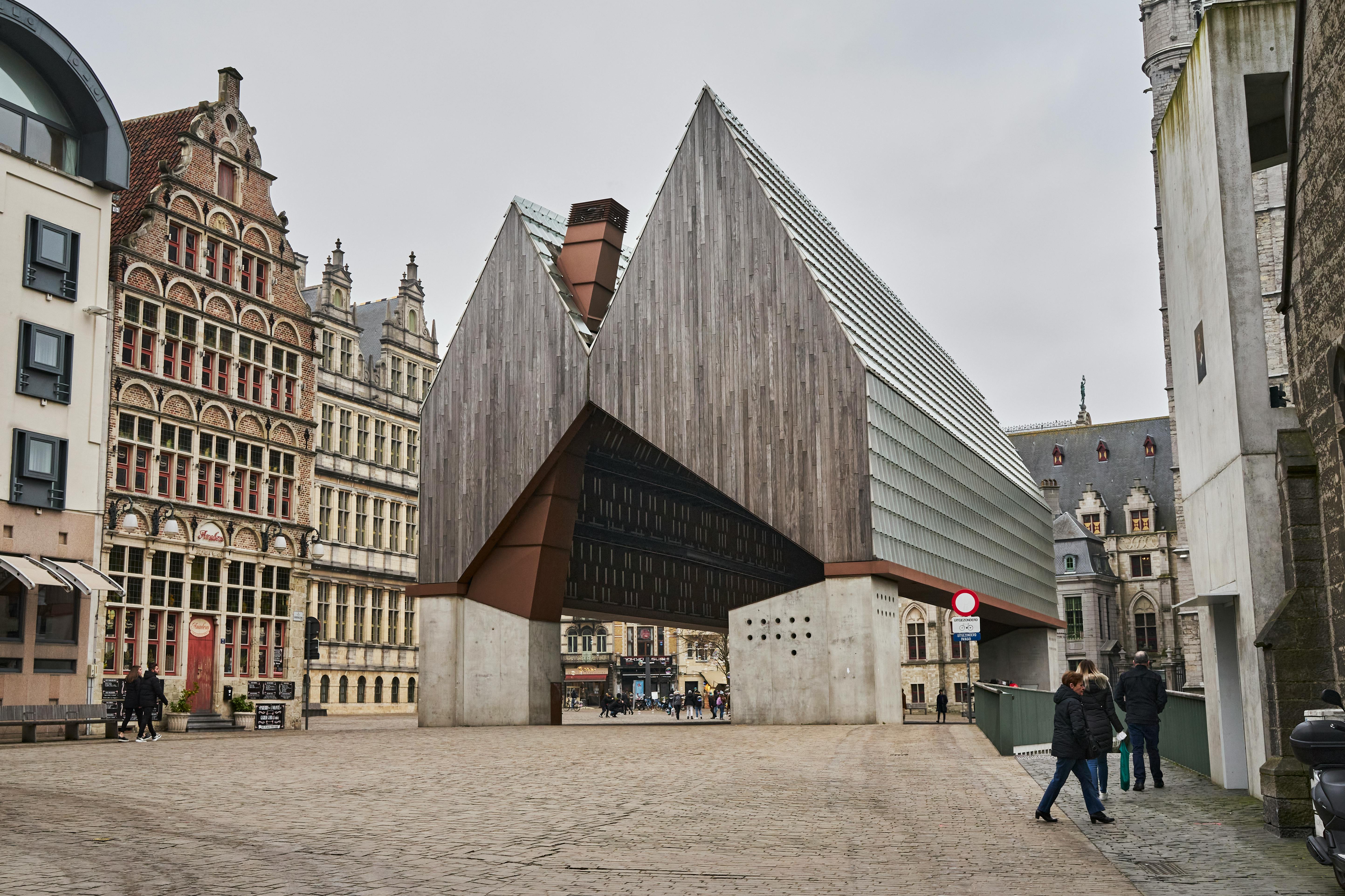 Contemporary pavilion in Ghent city plaza surrounded by historical buildings, without crowd.