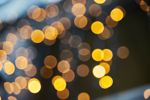 Free Yellow and orange bokeh lights create a festive and abstract visual effect. Stock Photo
