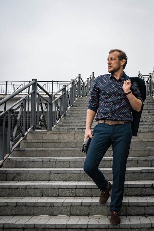 Free A Man Walking Down the Stairs Stock Photo