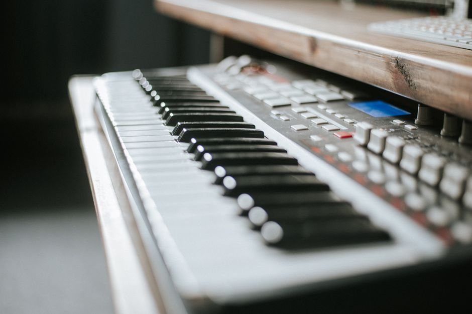 How White Noise Machines Like LectroFan Compare to Hatch Restore for Sleep Detailed view of an electronic keyboard in a music production studio setting.