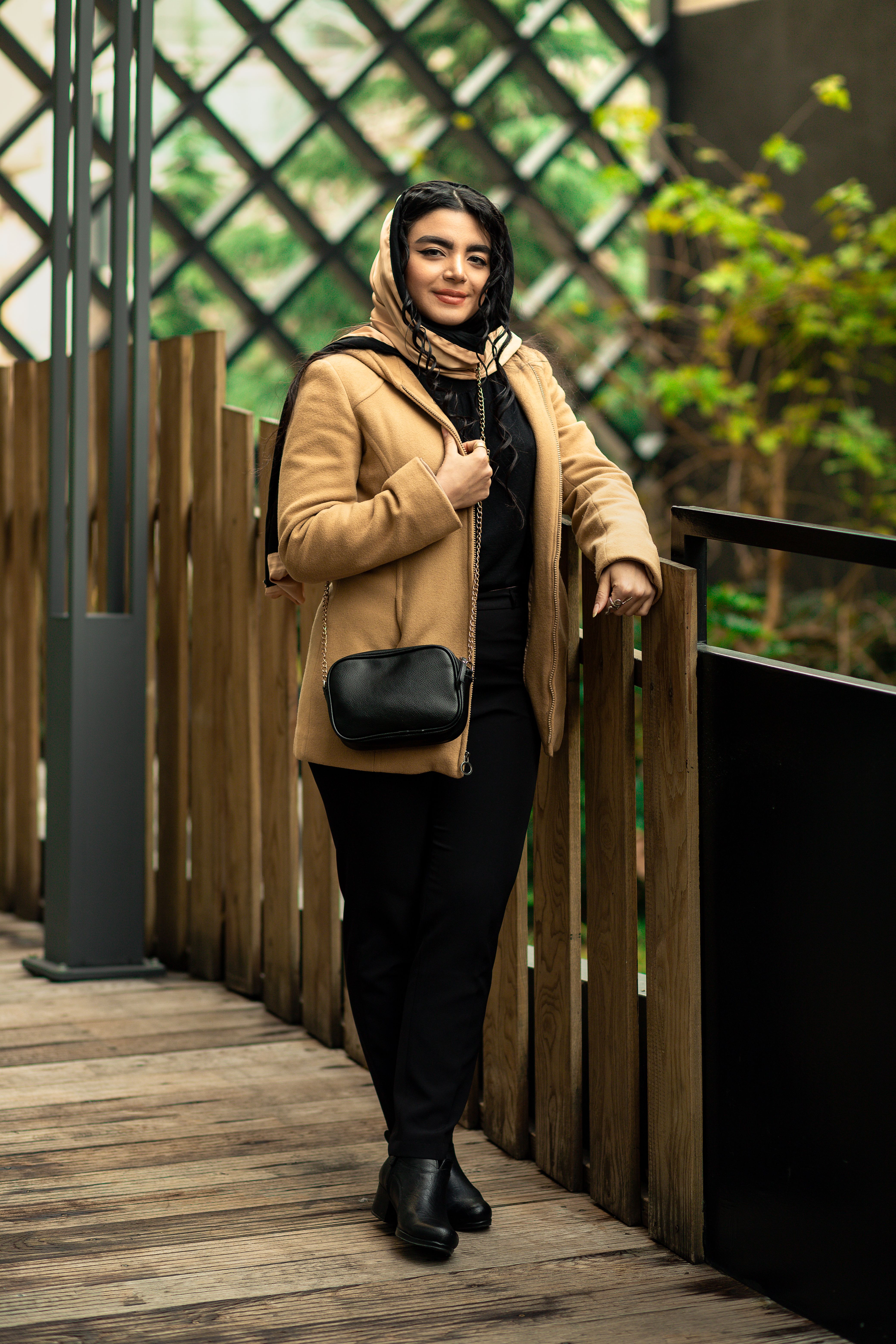 Woman in Brown Coat Standing Near Wooden Fence · Free Stock Photo