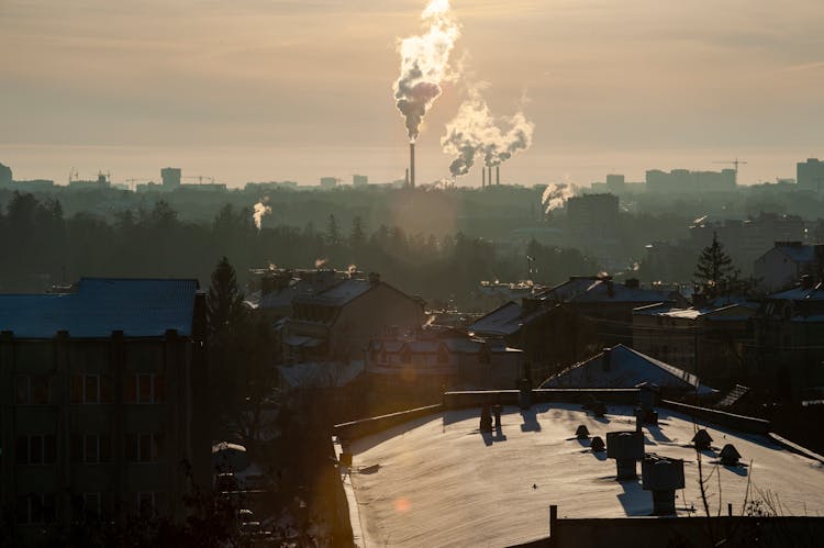 Smoke From The Chimneys Over The Rooftops In The City