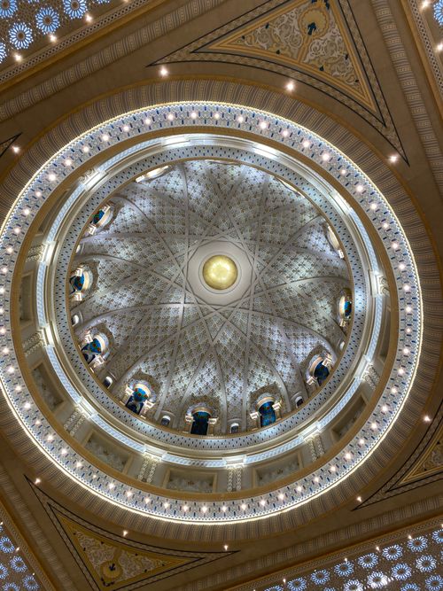 Free Stunning upward view of the illuminated dome inside Qasr Al Watan, Abu Dhabi, showcasing intricate architectural details. Stock Photo