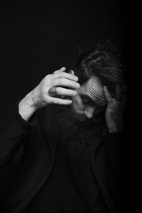 Grayscale Photo of a Bearded Man