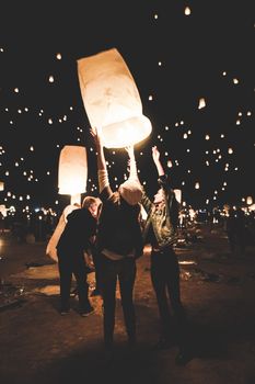People release glowing paper lanterns into the night sky at a festival in Las Vegas.