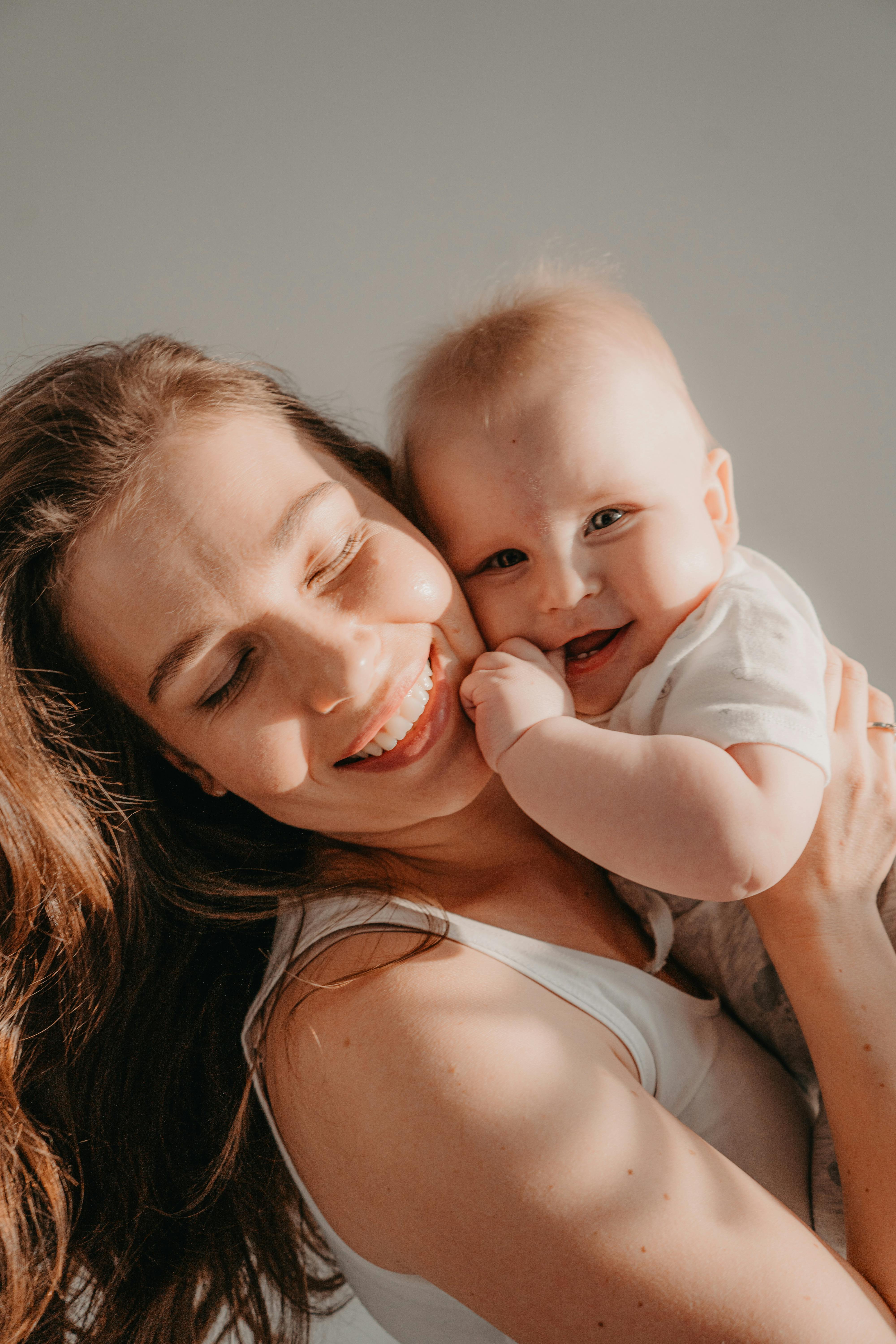 mother hugging her baby