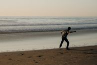 Person in a Slanted Position by the Shore