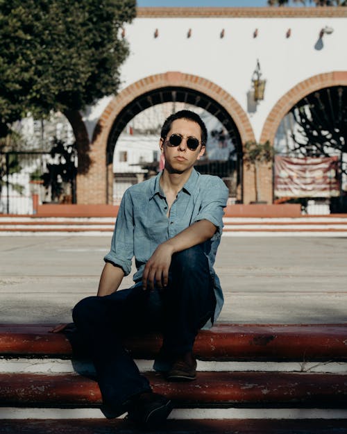 Man in Black Sunglasses sitting on Stairs