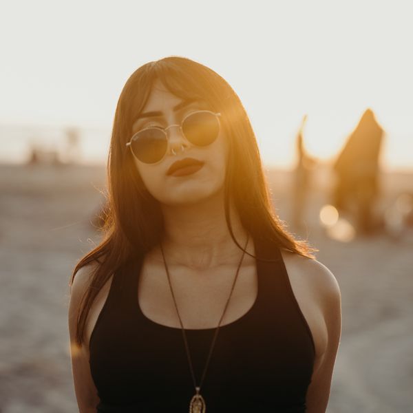 Woman in sunglasses at sunset, photo by Studio 31 on Pexels