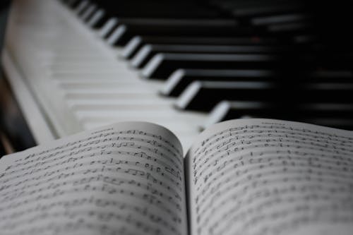 Sheet Music Near Piano Keys