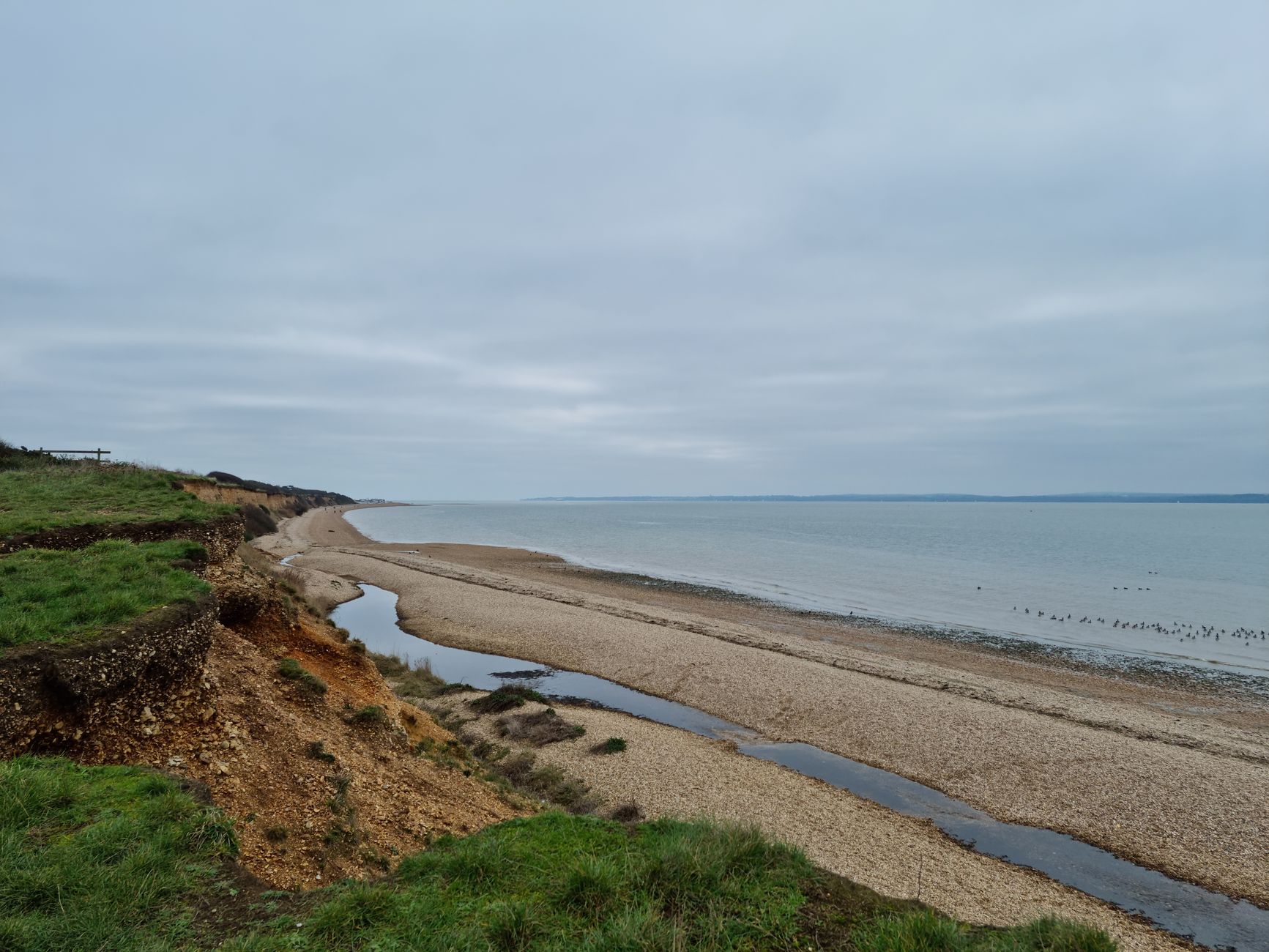 Calm seascape featuring cliffs and beaches in Hampshire, UK.