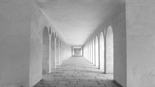 Grayscale Photo of Hallway