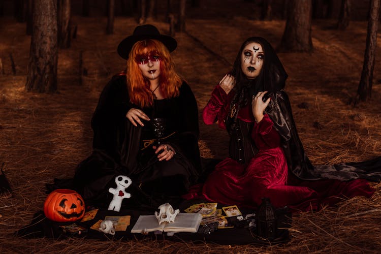 Women Dressed As Witches In The Forest