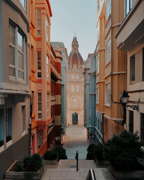 Alleyway between Concrete Buildings