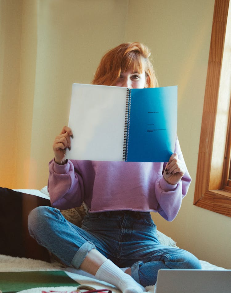 A Woman Holding A Manuscript