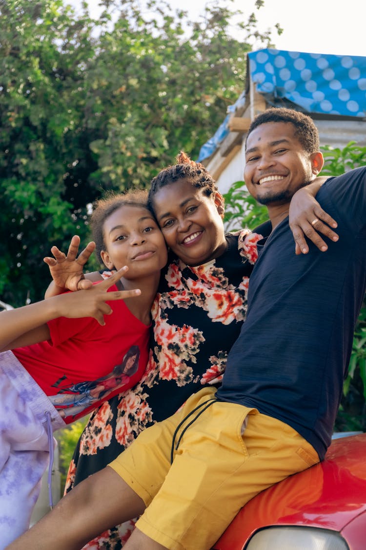 Family Smiling At The Camera