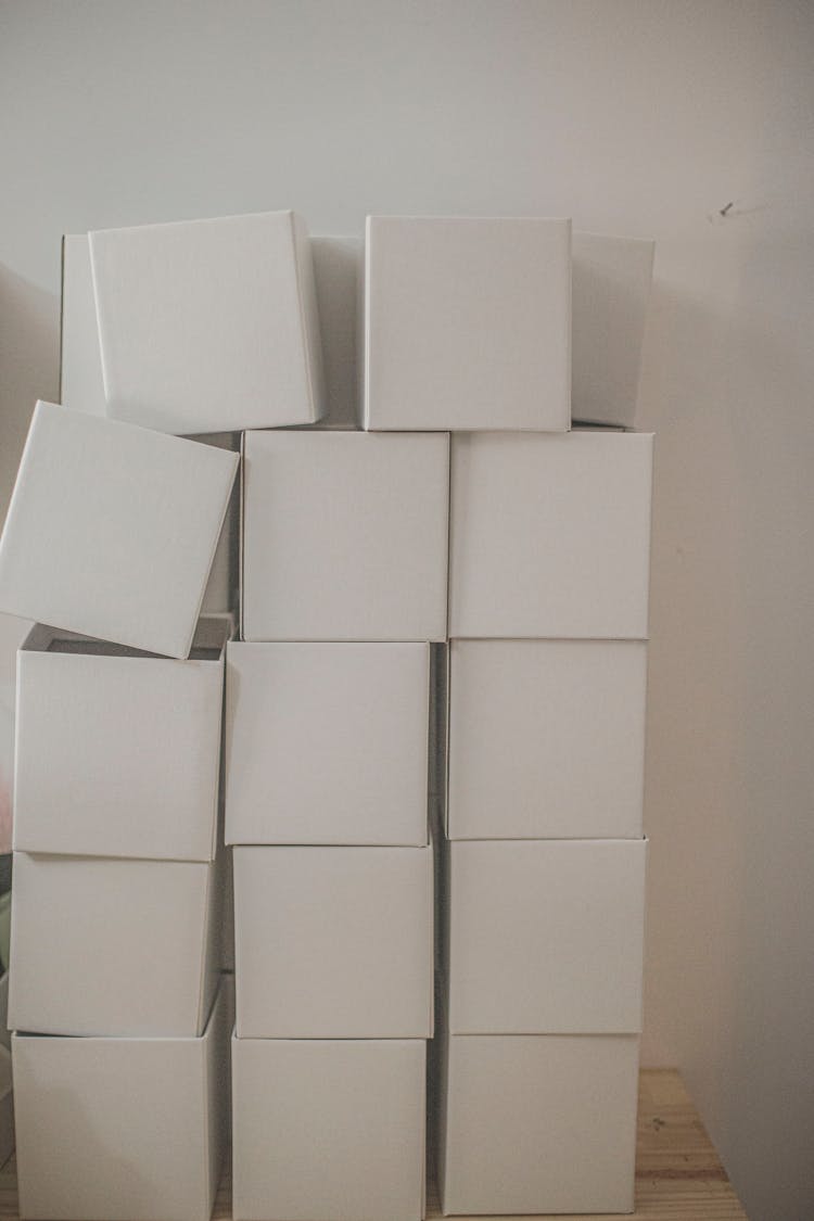 Stacked White Cardboard Boxes