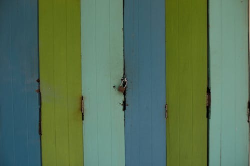 Wooden Doors Secured with a Padlock