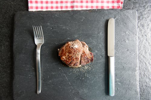 Free White Handled Fork Beside Brown Bread Stock Photo