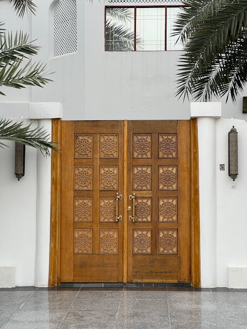 Free Wooden Door on White Building Stock Photo