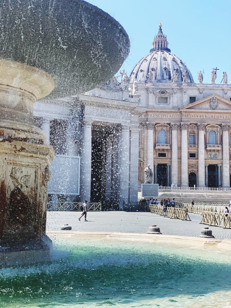 The Bernini Fountain At St. Peter's Square In Rome