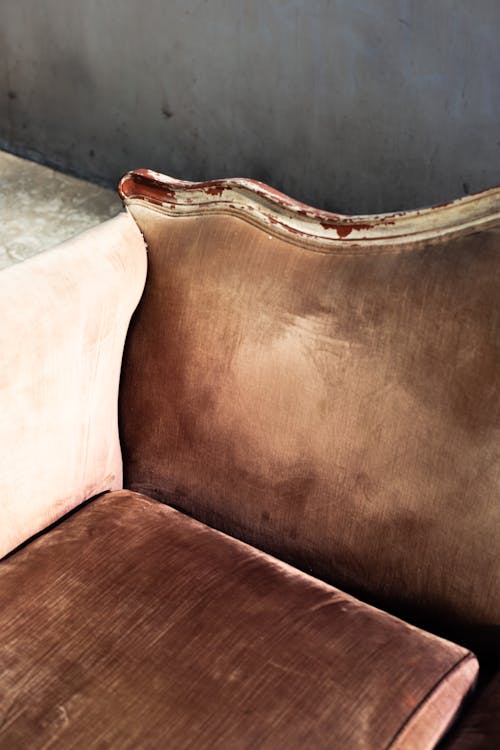 Close-up Photo of Shabby Sofa 