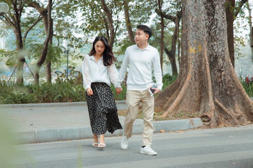 A Couple Walking on the Street