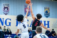 Man in White and Blue Jersey Shirt Holding Basketball