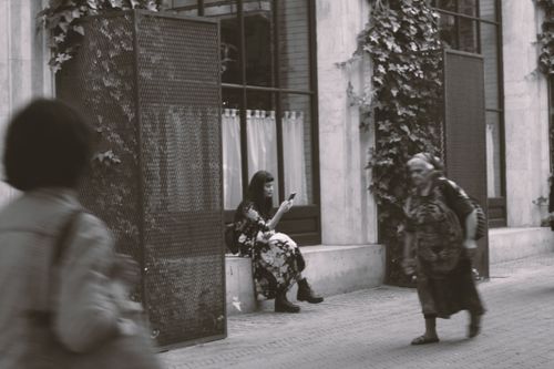 Free Black and white photo capturing people in motion on a city street. Stock Photo