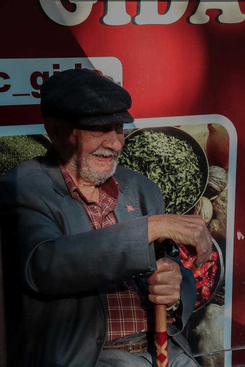 Elderly Man Holding a Cane